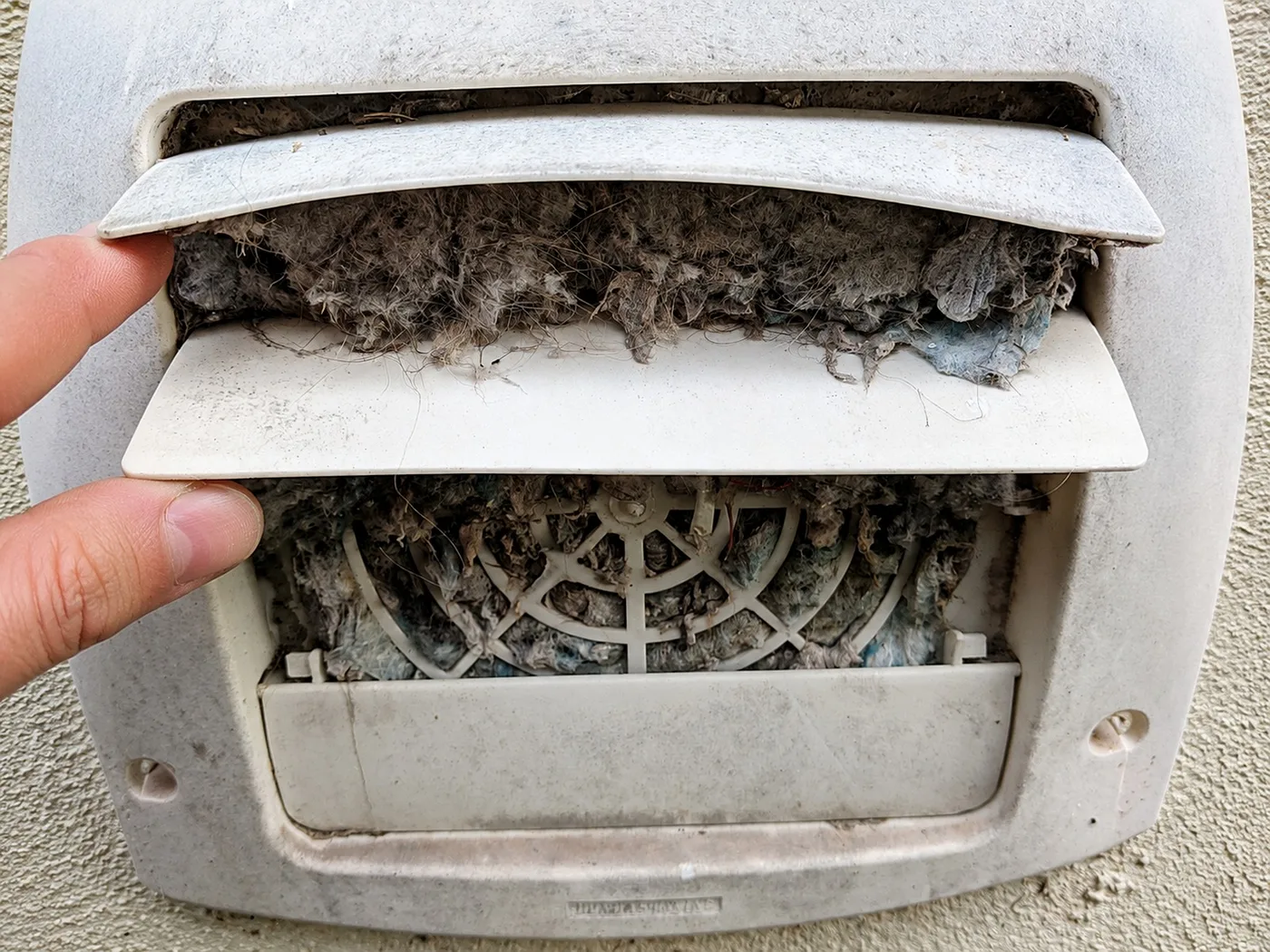 Exterior Wall Vent Blocked by Lint